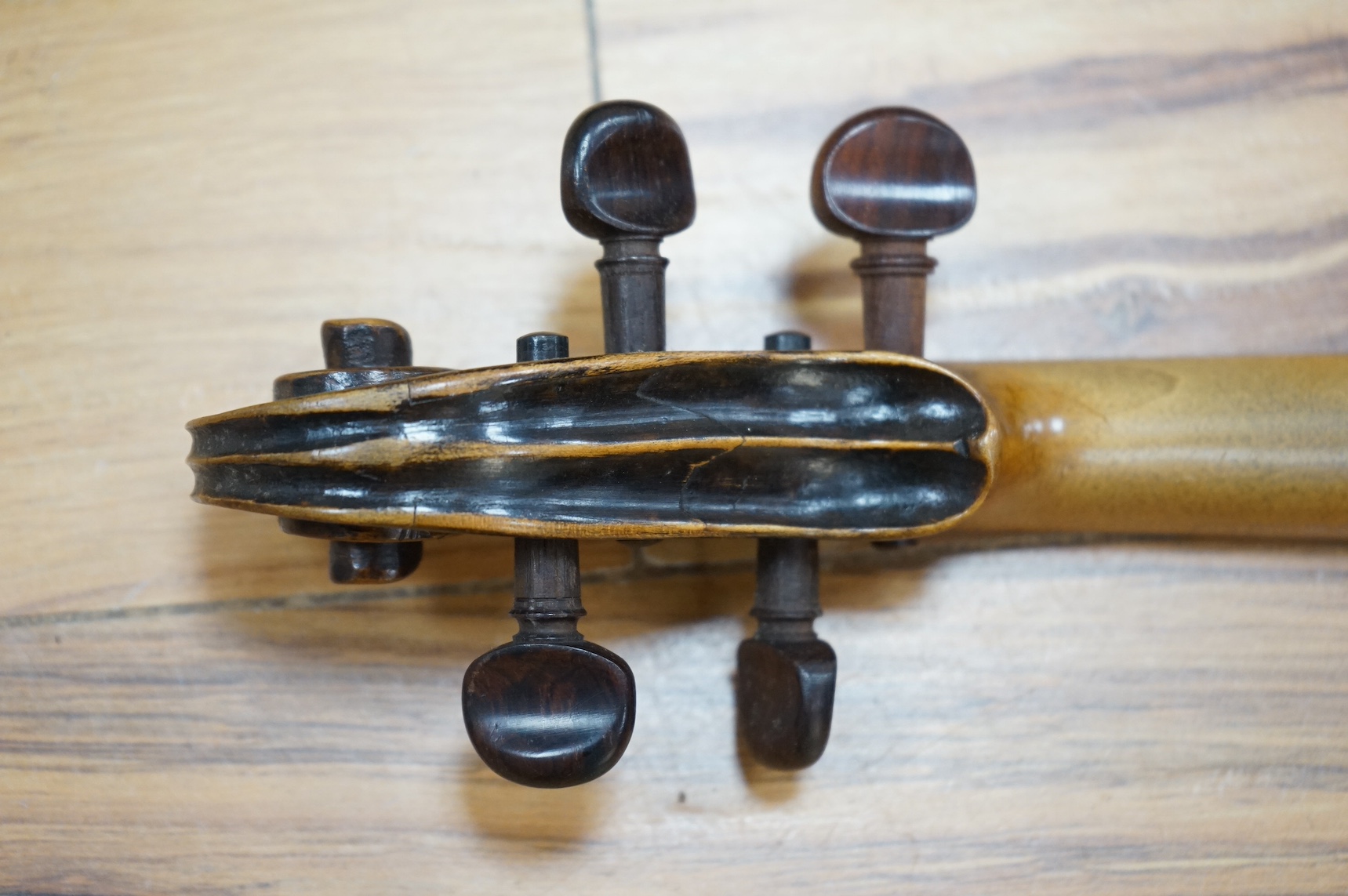 A cased 19th century French violin, back, 36cm. Condition - fair